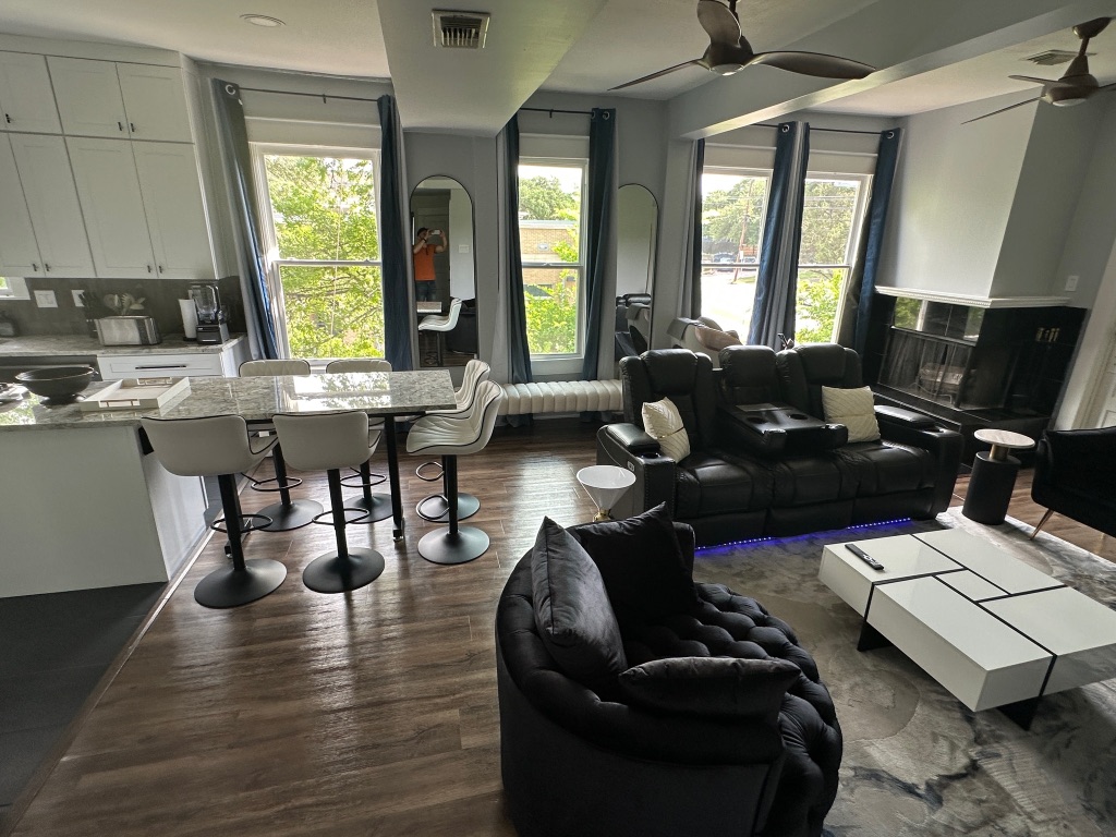3210 Hampton Road, Unit A B C Austin, TX 78705 - Photo 28 of 39 a living room with furniture two large window and wooden floor