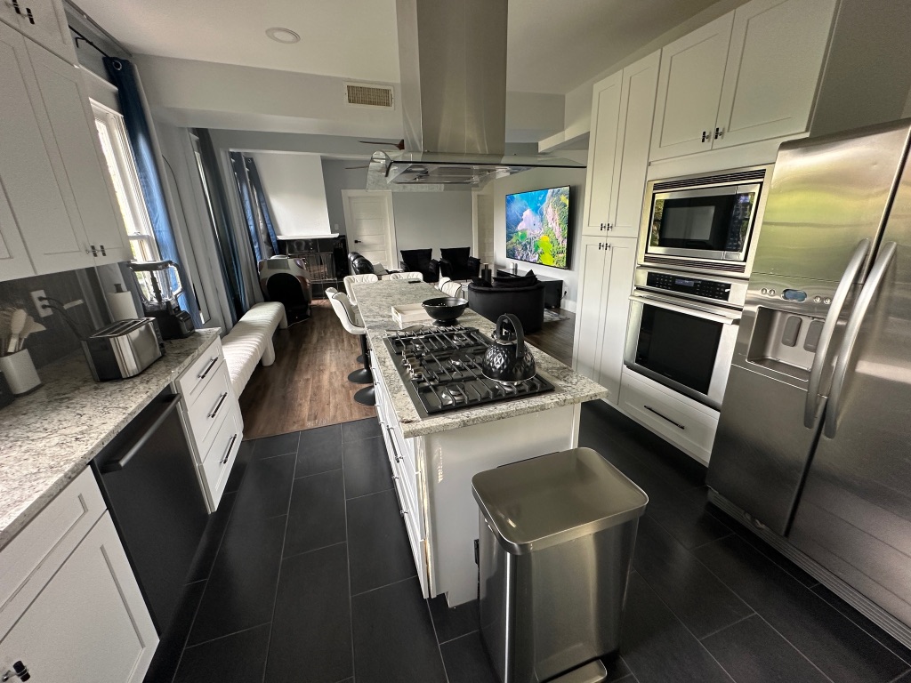 3210 Hampton Road, Unit A B C Austin, TX 78705 - Photo 39 of 39 a kitchen with stainless steel appliances granite countertop a sink stove and refrigerator