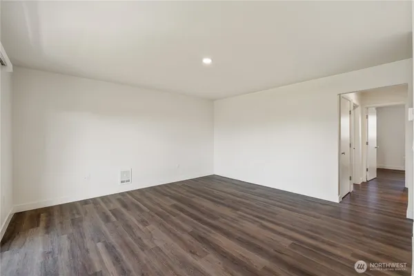 a view of hallway with wooden floor
