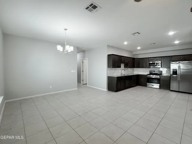 a view of a hallway with a large mirror