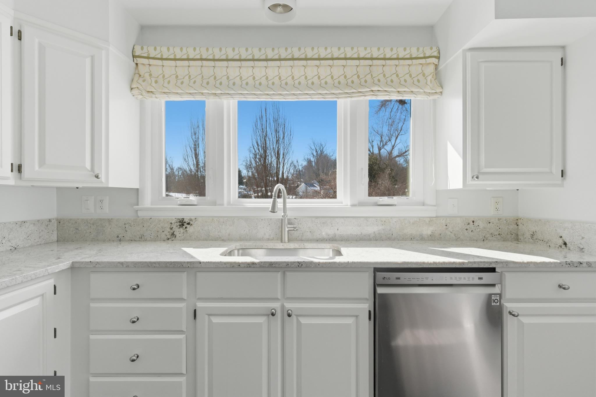 5020 Alta Vista Road Bethesda, MD 20814 - Photo 12 of 41 a kitchen with a sink cabinets and window