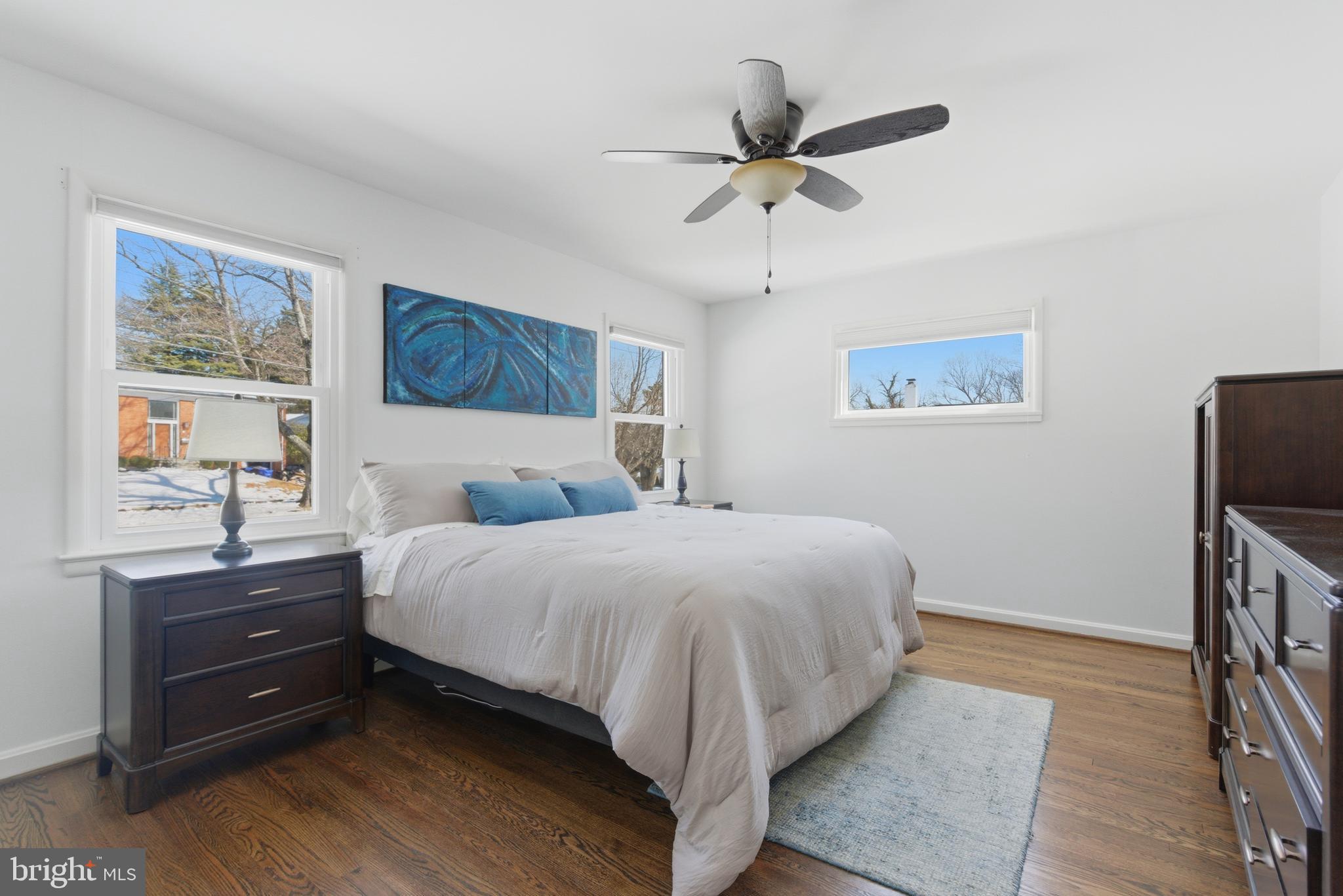 5020 Alta Vista Road Bethesda, MD 20814 - Photo 13 of 41 a bedroom with a bed and a chandelier