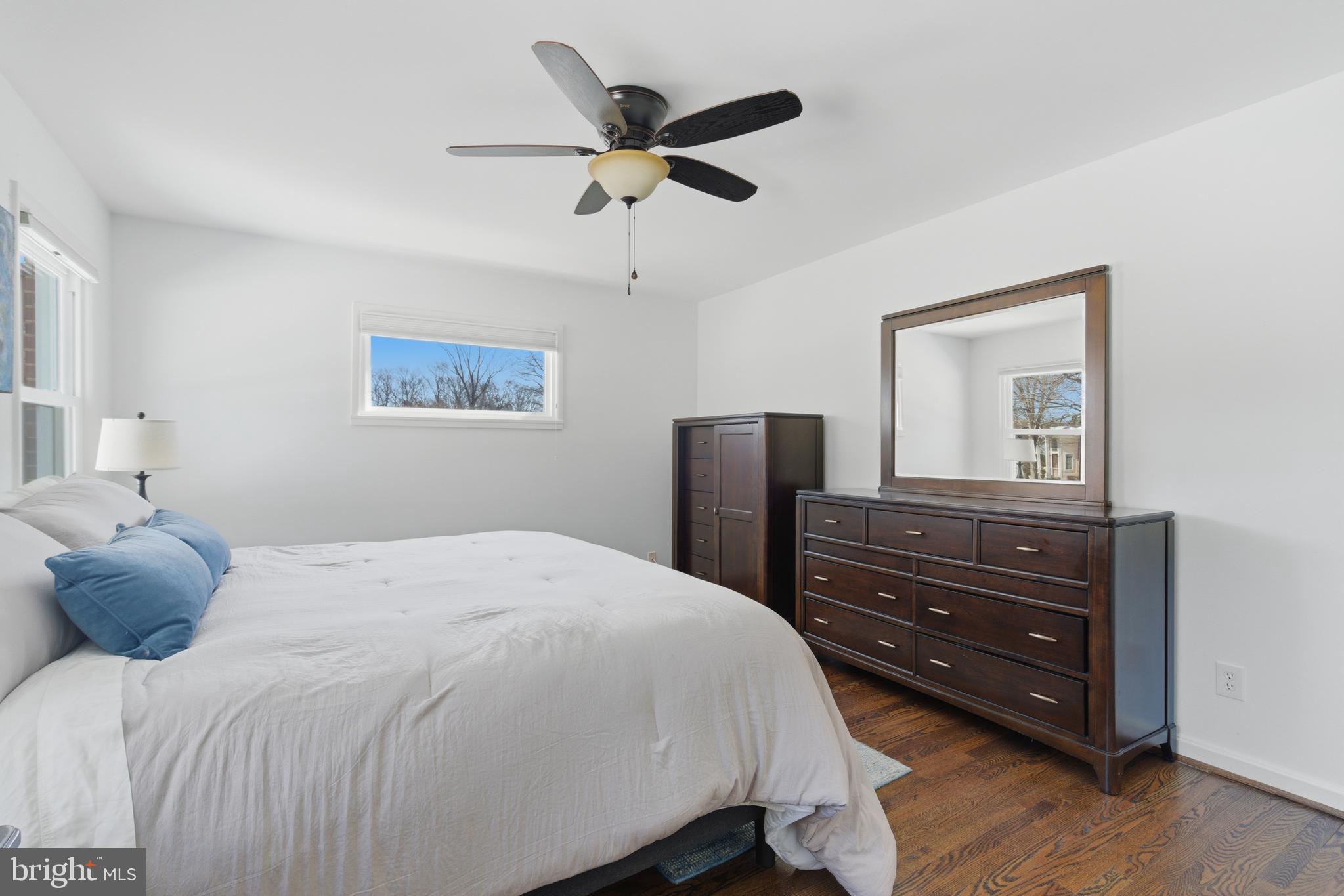 5020 Alta Vista Road Bethesda, MD 20814 - Photo 15 of 41 a bedroom with a bed and wooden floor