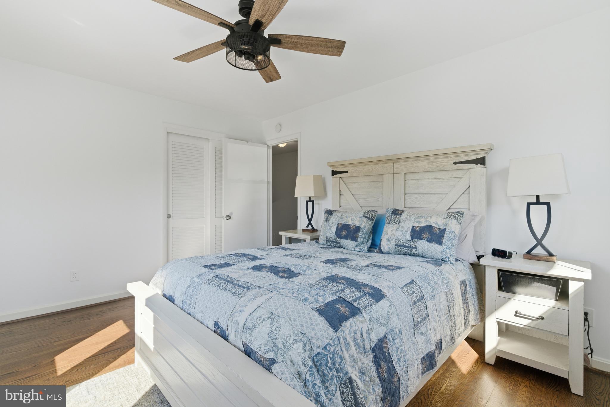 5020 Alta Vista Road Bethesda, MD 20814 - Photo 20 of 41 a bedroom with a bed and a chandelier