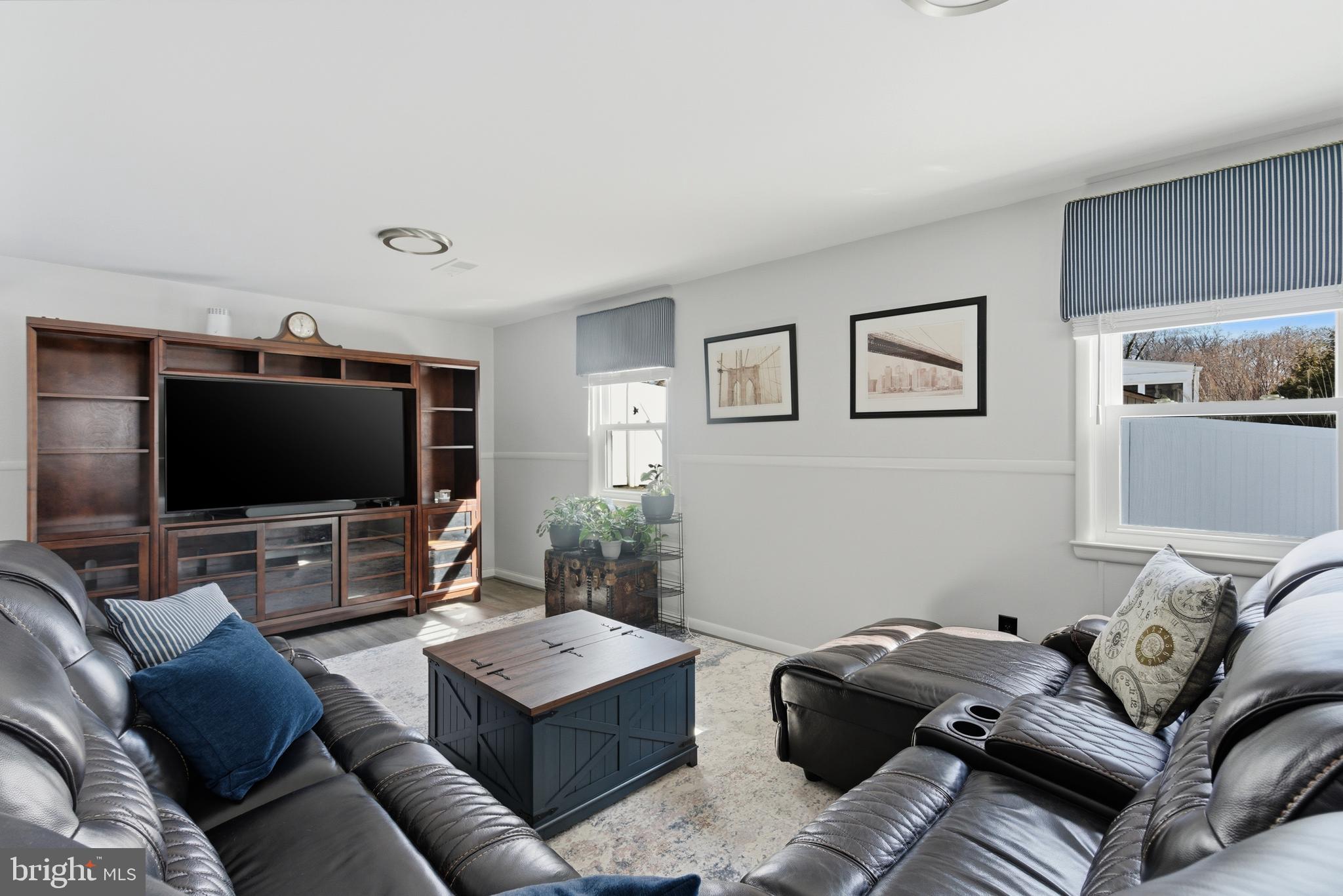 5020 Alta Vista Road Bethesda, MD 20814 - Photo 24 of 41 a living room with furniture and a flat screen tv