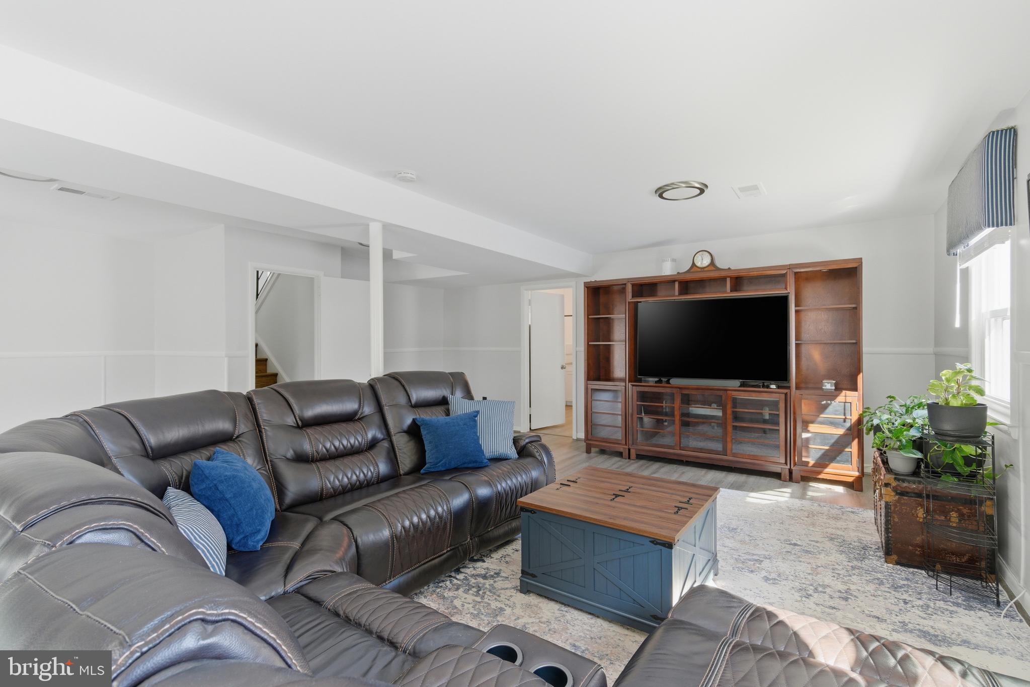 5020 Alta Vista Road Bethesda, MD 20814 - Photo 26 of 41 a living room with furniture and a flat screen tv