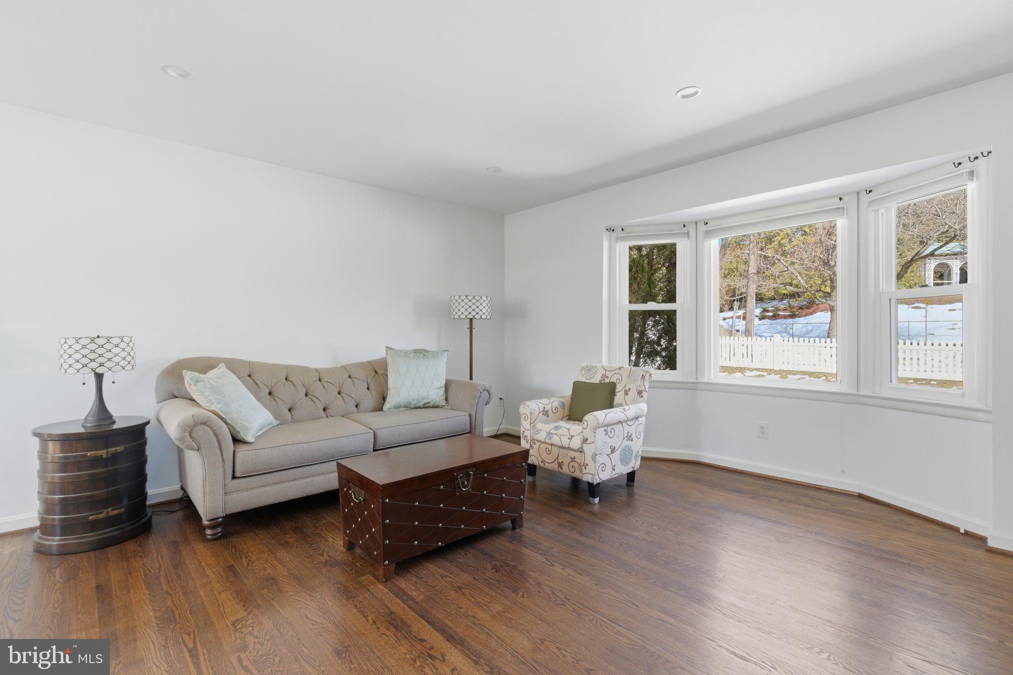 5020 Alta Vista Road Bethesda, MD 20814 - Photo 3 of 41 a living room with couches bookshelf and a large window