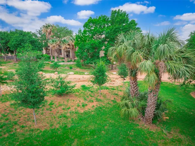a backyard of a house with lots of green space