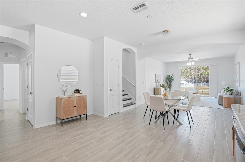 12351 Ridgedale Drive Hudson, FL 34669 - Photo 13 of 48 a view of a dining room with furniture and wooden floor