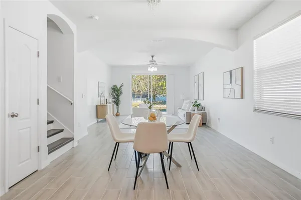 a view of a dining room with furniture window and wooden floor