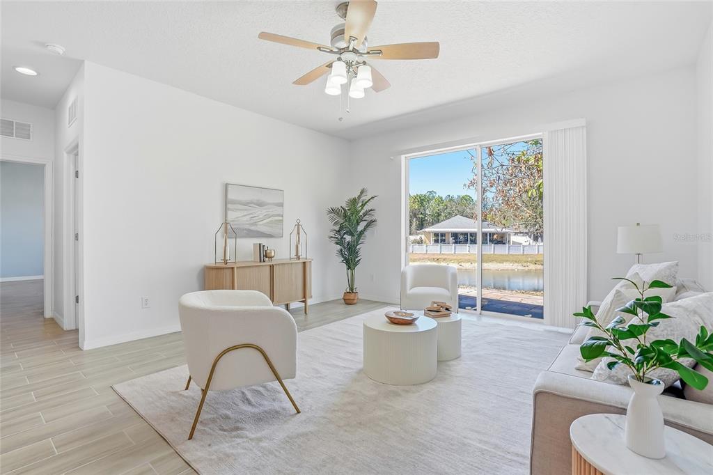 12351 Ridgedale Drive Hudson, FL 34669 - Photo 17 of 48 a living room with furniture potted plant and a window