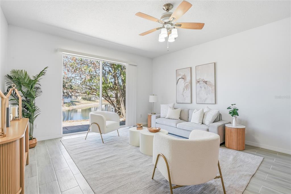 12351 Ridgedale Drive Hudson, FL 34669 - Photo 17 of 48 a living room with furniture and a large window