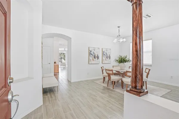 wooden floor in a hall with a window