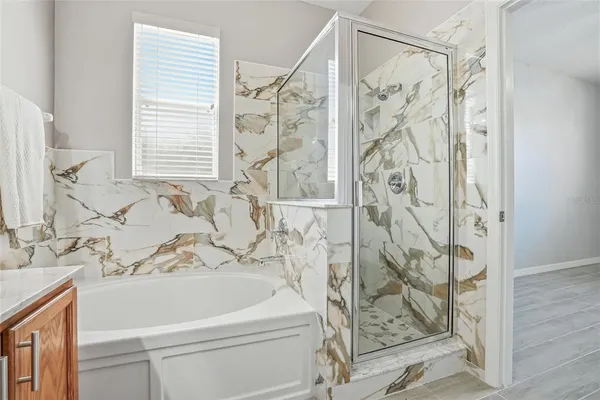 a bathroom with a shower curtain and a sink