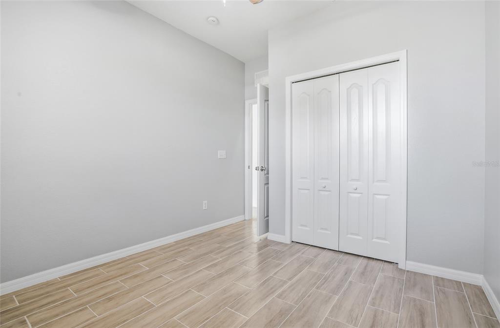 12351 Ridgedale Drive Hudson, FL 34669 - Photo 29 of 48 a view of an empty room with wooden floor