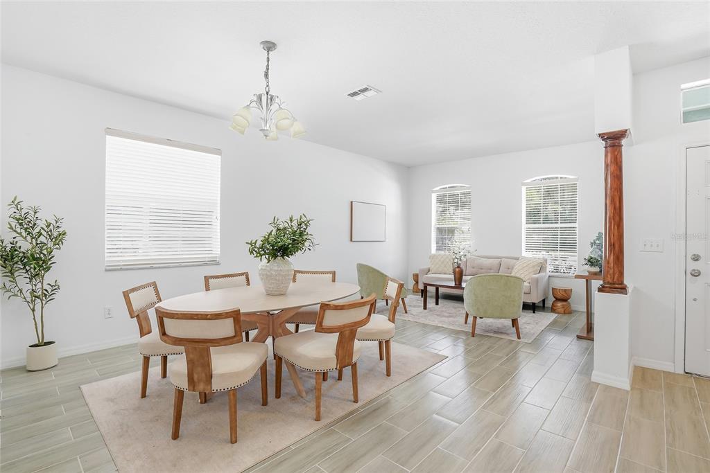 12351 Ridgedale Drive Hudson, FL 34669 - Photo 3 of 48 a view of a dining room with furniture window and wooden floor