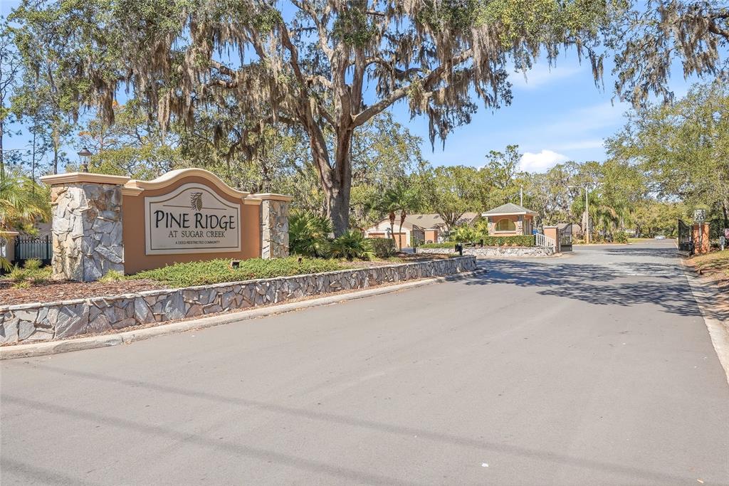 12351 Ridgedale Drive Hudson, FL 34669 - Photo 44 of 48 a sign board on the side of a street