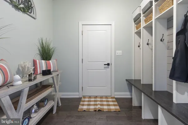 a bedroom with furniture and a large window