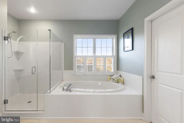 a bedroom with a bed and flat screen tv