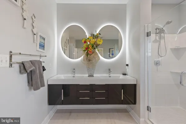 a white toilet sitting next to a bathroom sink