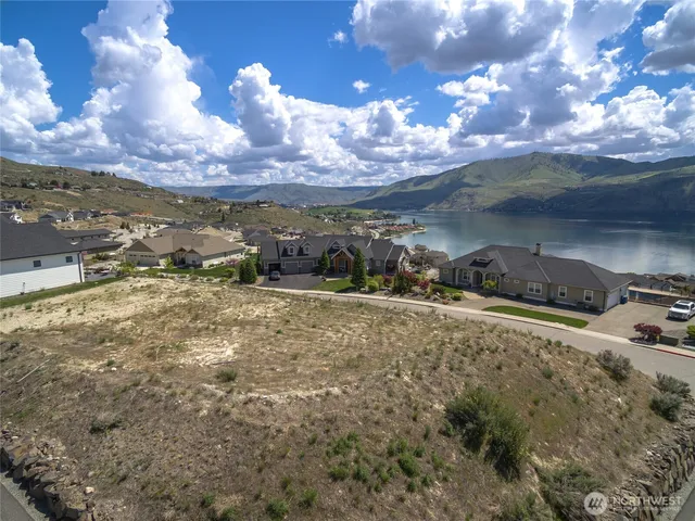 a view of a town with mountains in the background