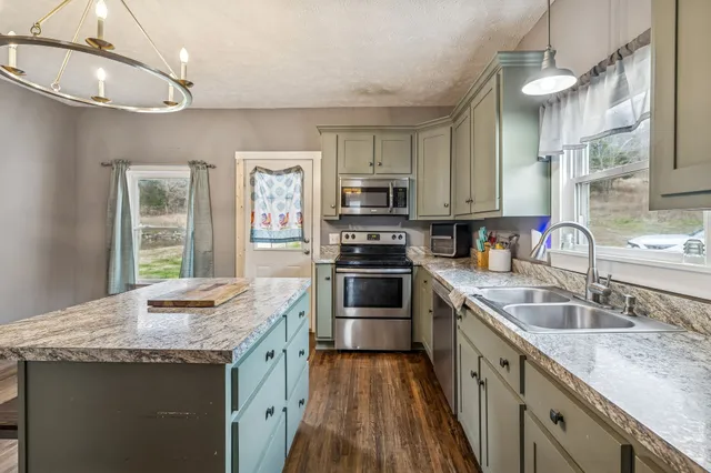 a bedroom with furniture and a flat screen tv
