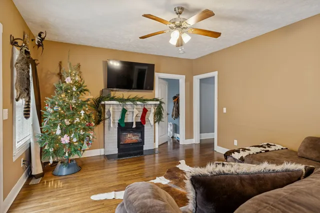 a living room with furniture and a flat screen tv
