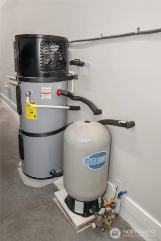 a view of a sink with wooden cabinet