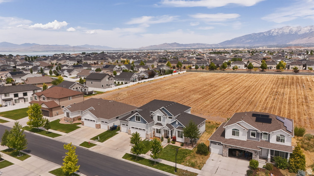 111 East Silver Oak Road Vineyard, UT 84059 - Photo 46 of 50 Aerial perspective showcasing a residential community with distant mountains and a body of water