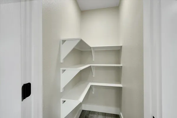 a view of an empty walk in closet