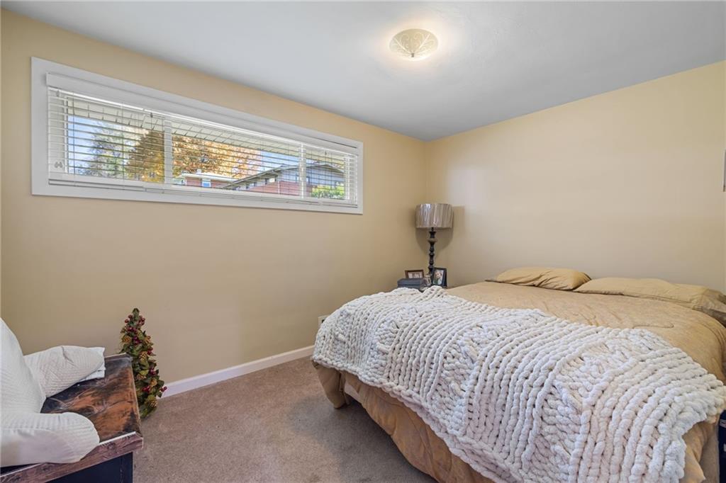 587 Firethorne Drive Monroeville, PA 15146 - Photo 16 of 29 a bedroom with a bed and a window