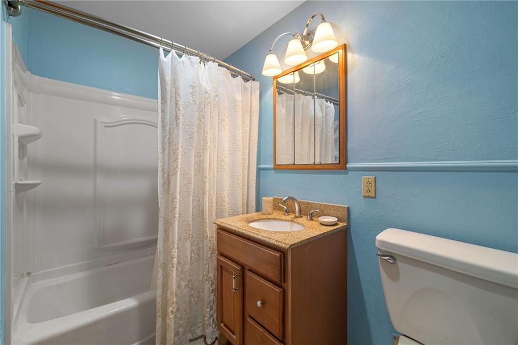 587 Firethorne Drive Monroeville, PA 15146 - Photo 18 of 29 a bathroom with a toilet sink and mirror