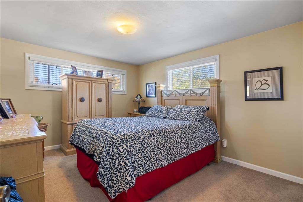 587 Firethorne Drive Monroeville, PA 15146 - Photo 19 of 29 a bed sitting in a bedroom next to a window