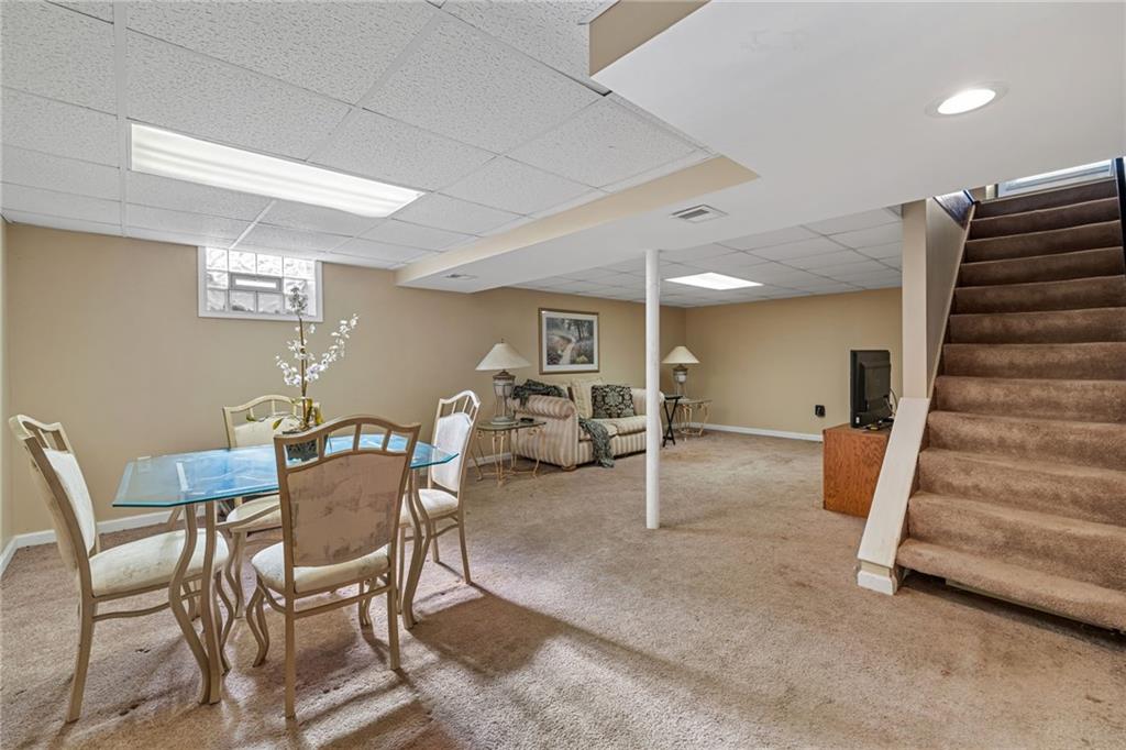 587 Firethorne Drive Monroeville, PA 15146 - Photo 23 of 29 a view of a livingroom with furniture and a ceiling fan