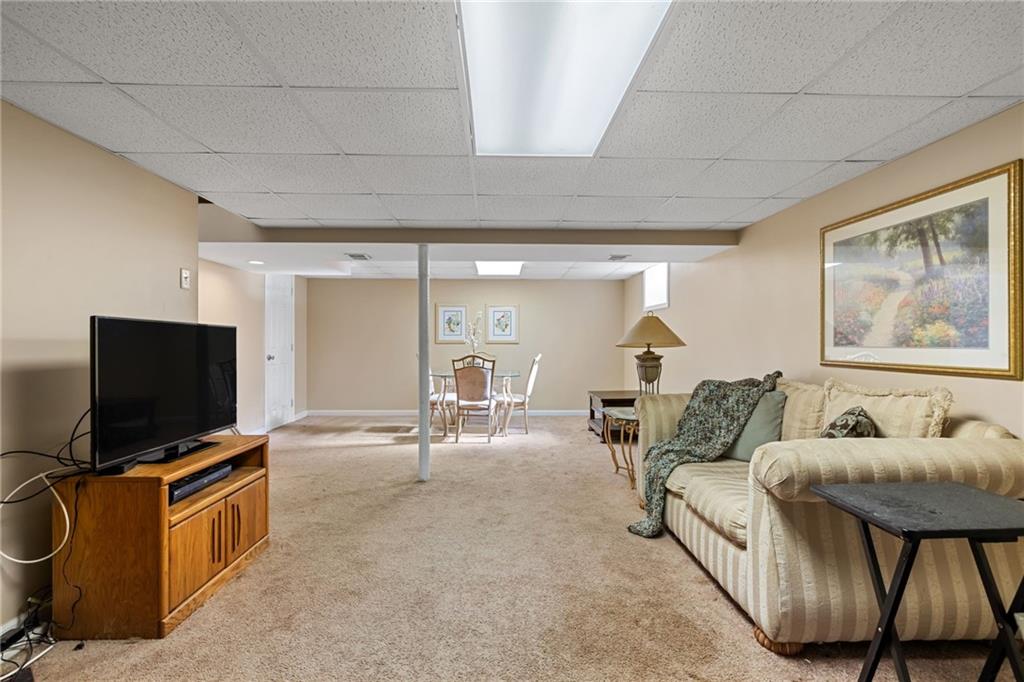 587 Firethorne Drive Monroeville, PA 15146 - Photo 26 of 29 a living room with furniture and a flat screen tv