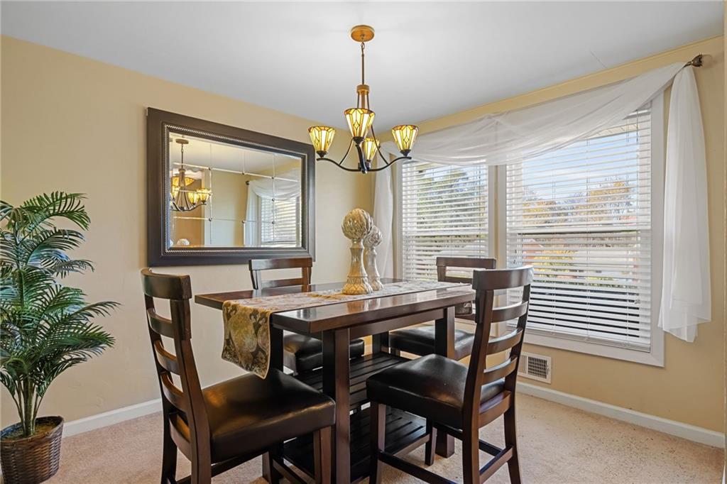 587 Firethorne Drive Monroeville, PA 15146 - Photo 6 of 29 a view of a dining room with furniture and window