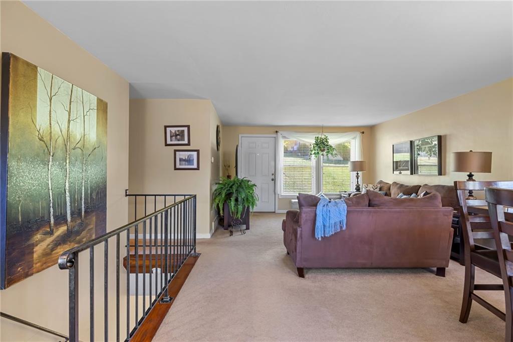 587 Firethorne Drive Monroeville, PA 15146 - Photo 7 of 29 a living room with furniture and large windows