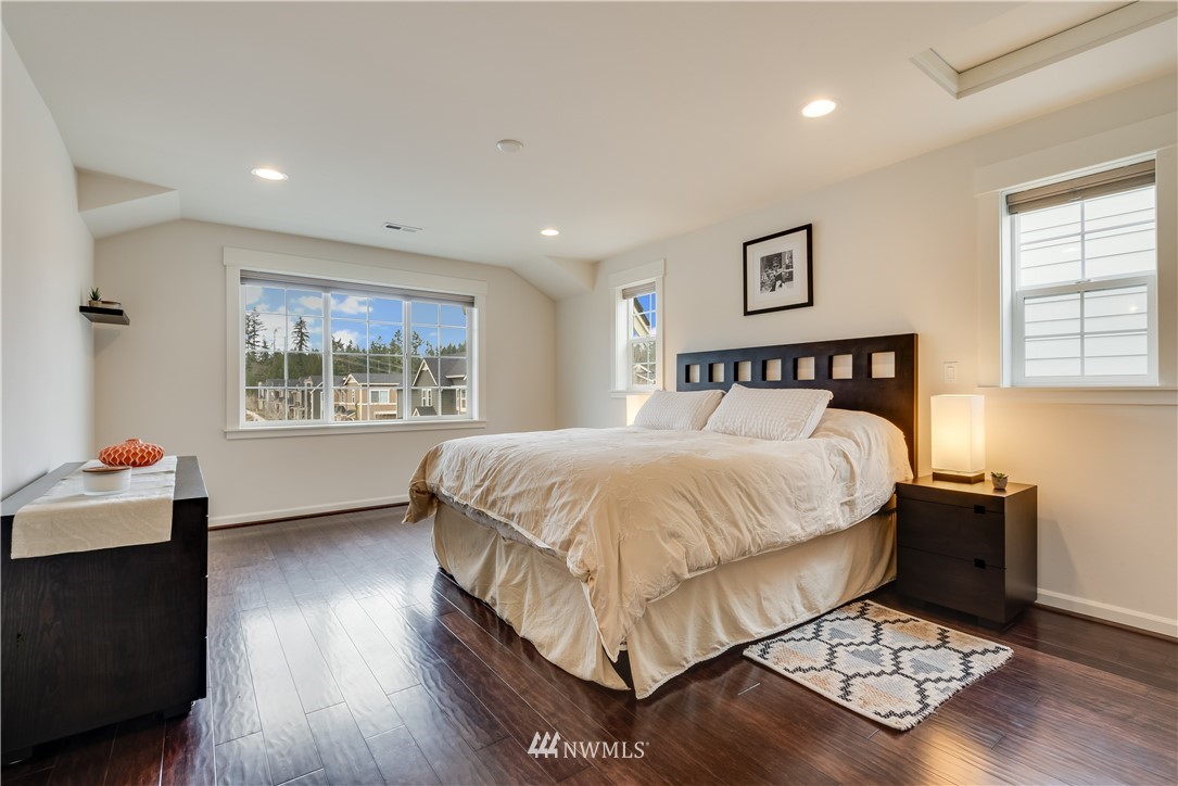 4408 186th Street Southeast Bothell, WA 98012 - Photo 13 of 23 a bed sitting in a bedroom next to a window