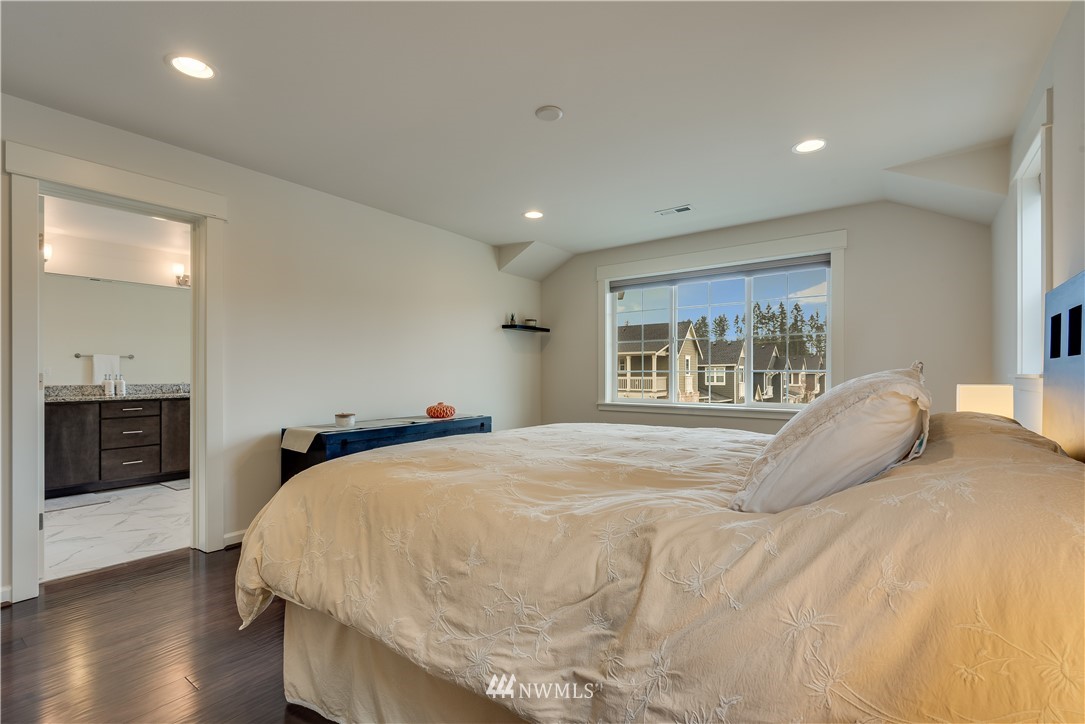 4408 186th Street Southeast Bothell, WA 98012 - Photo 15 of 23 a bedroom with a bed and a large window