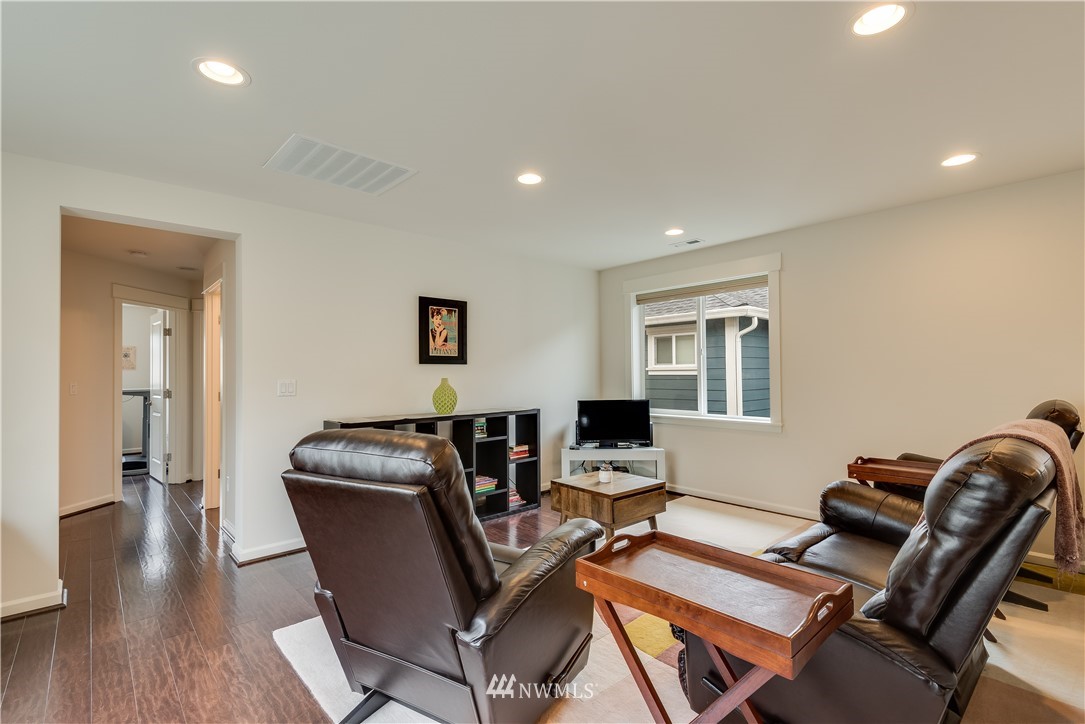 4408 186th Street Southeast Bothell, WA 98012 - Photo 19 of 23 a workspace with furniture and wooden floor