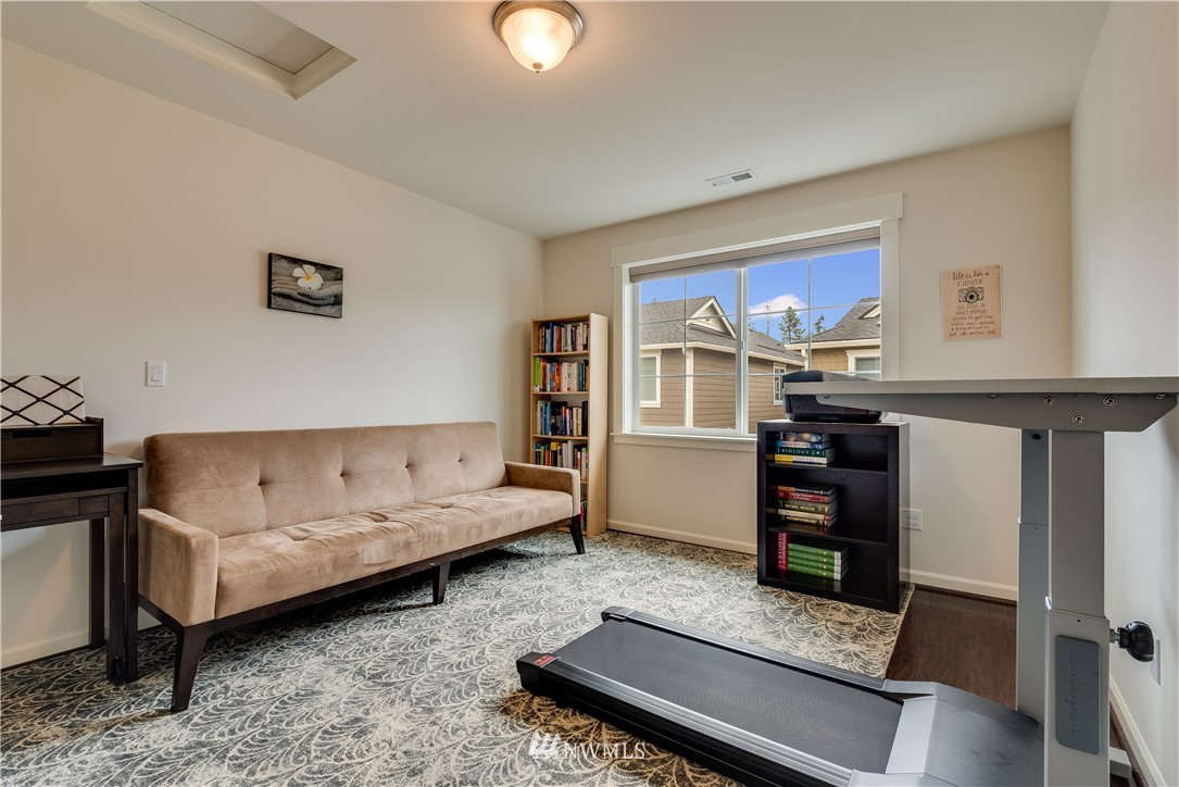 4408 186th Street Southeast Bothell, WA 98012 - Photo 21 of 23 a living room with furniture and a window