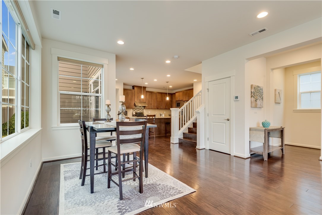 4408 186th Street Southeast Bothell, WA 98012 - Photo 5 of 23 a view of a dining room with furniture and wooden floor