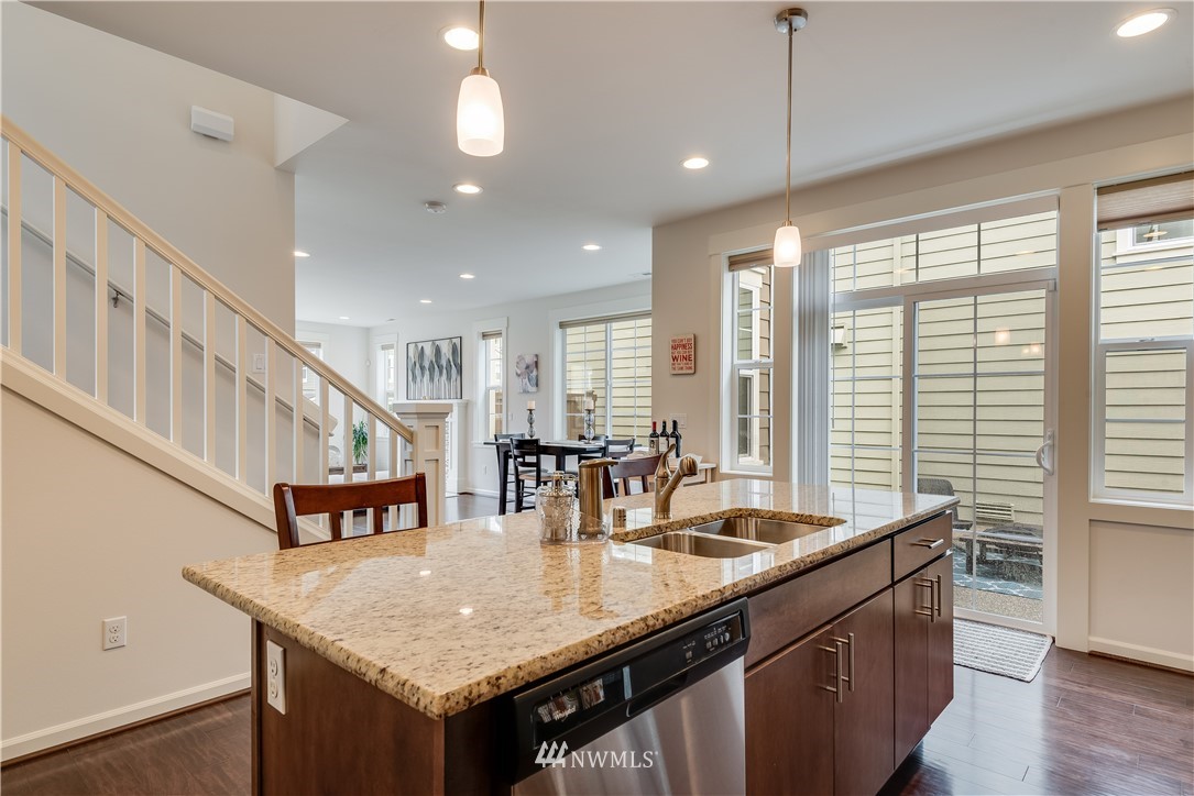 4408 186th Street Southeast Bothell, WA 98012 - Photo 10 of 23 a kitchen with center island table and chairs
