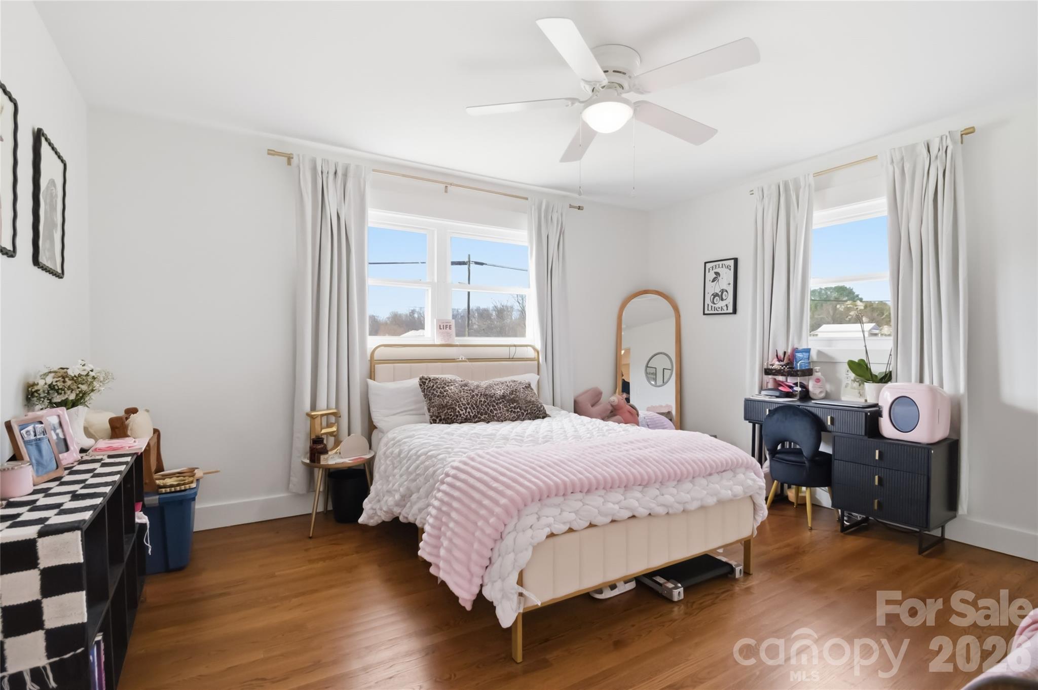 28461 Canton Road Albemarle, NC 28001 - Photo 19 of 30 a bedroom with a bed and a chandelier