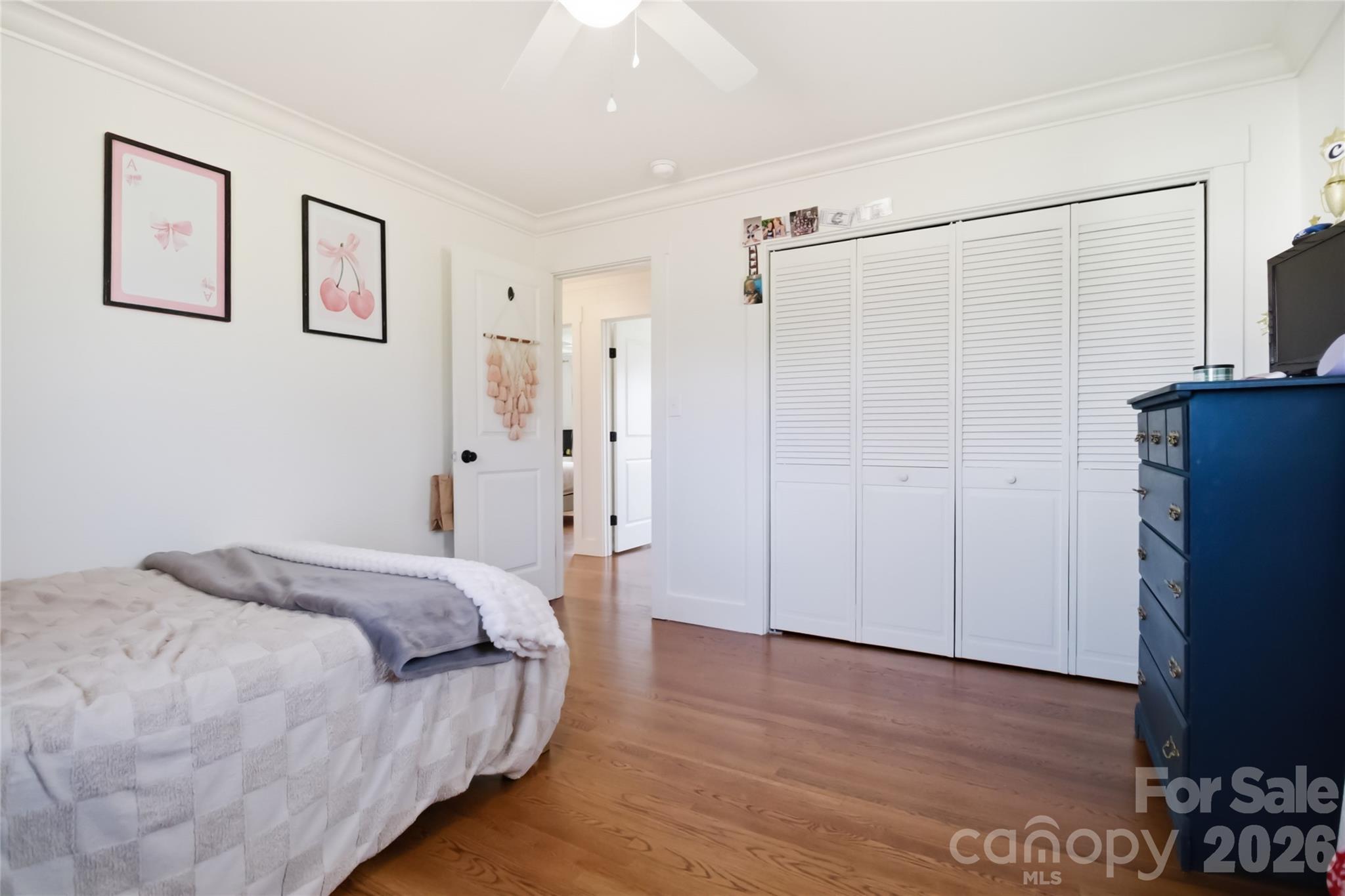 28461 Canton Road Albemarle, NC 28001 - Photo 21 of 30 a spacious bedroom with a bed and a refrigerator