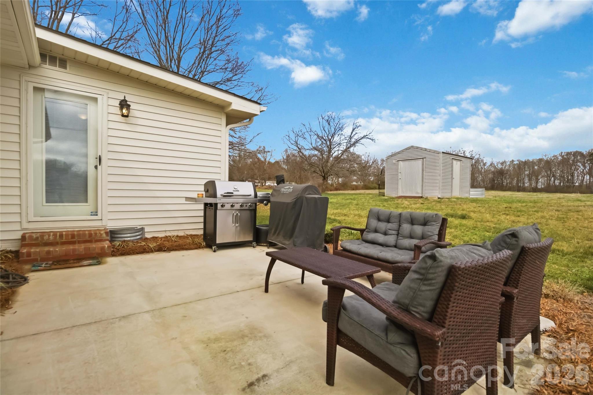 28461 Canton Road Albemarle, NC 28001 - Photo 27 of 30 a view of a terrace with furniture and a yard