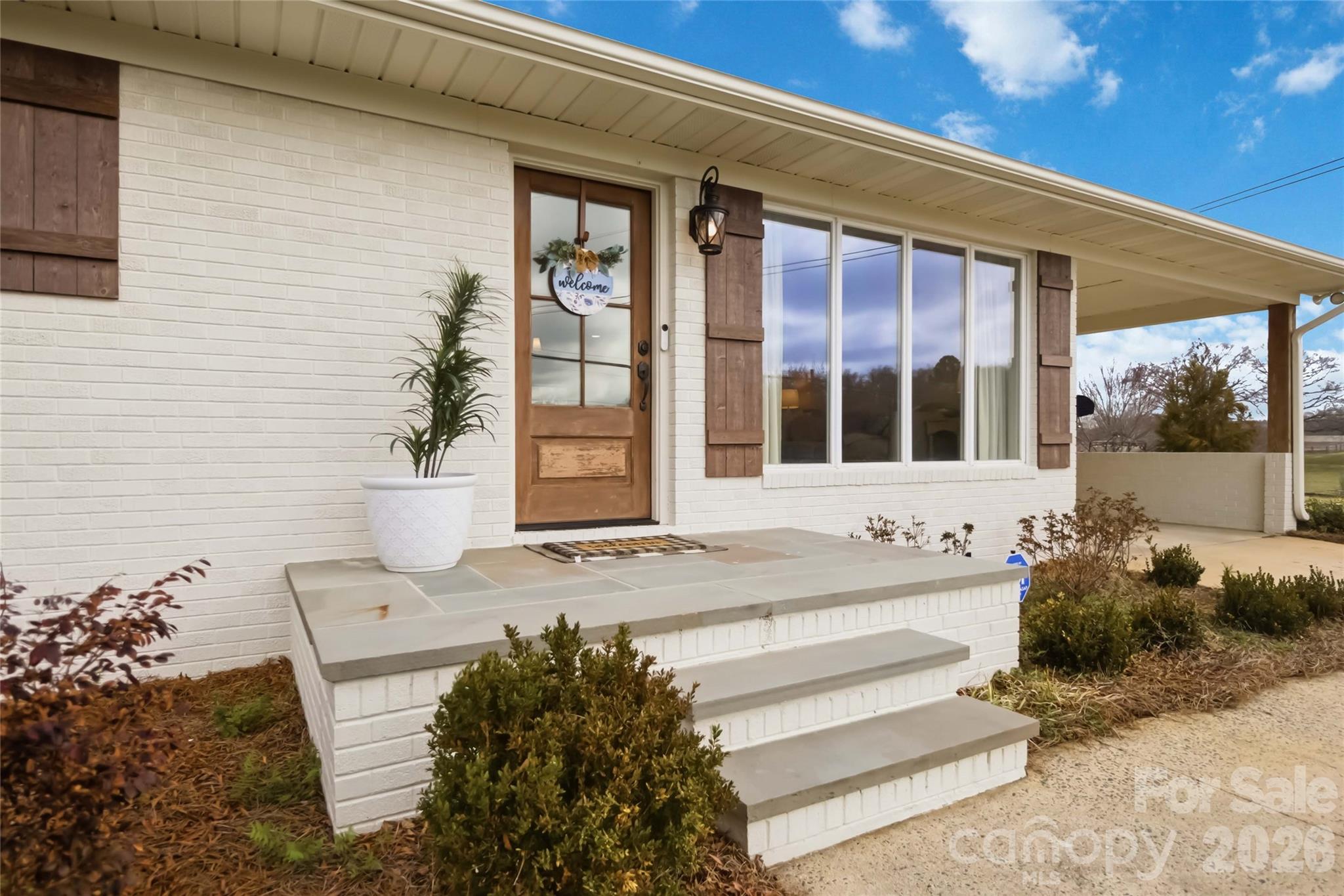 28461 Canton Road Albemarle, NC 28001 - Photo 4 of 30 a front view of a house with a yard