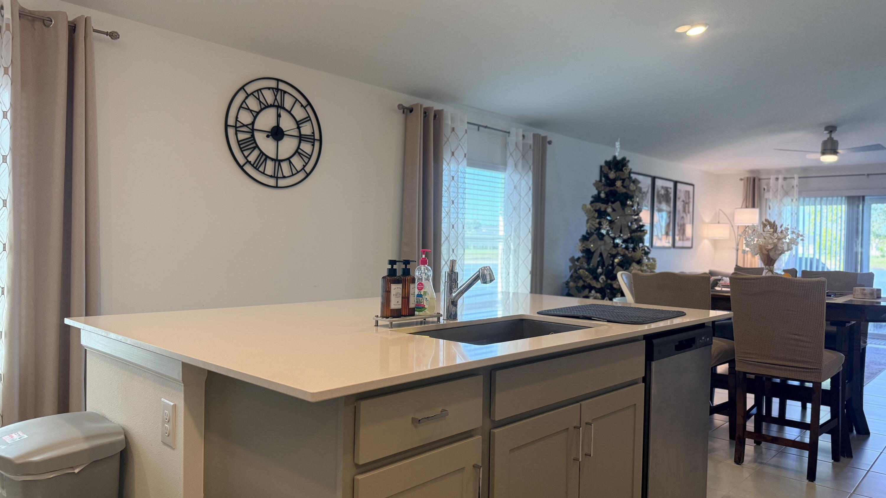682 Papillon Street Southwest Palm Bay, FL 32908 - Photo 12 of 30 a kitchen with a table and chairs in it