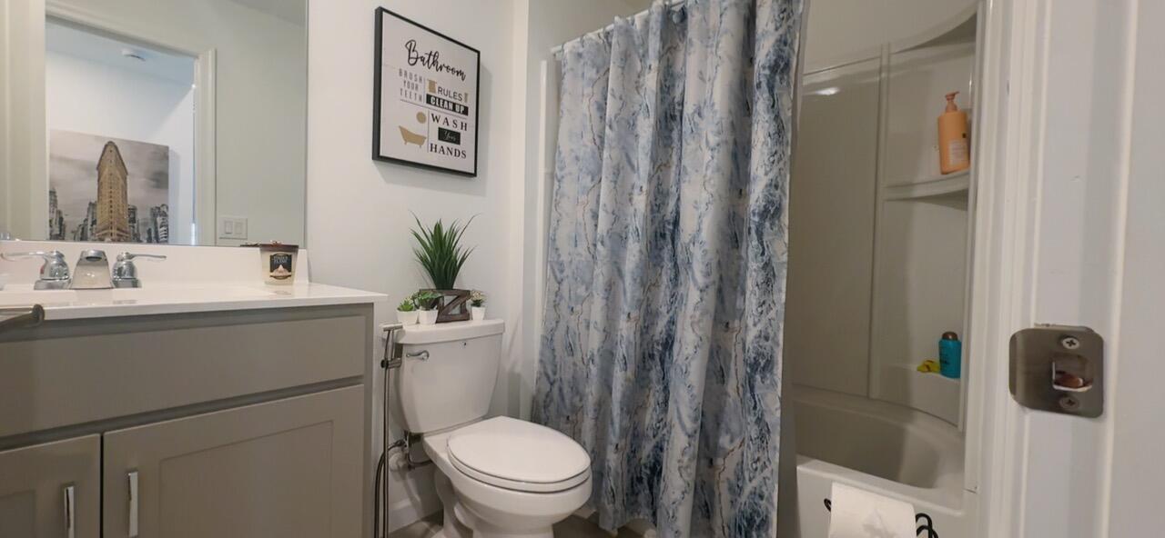 682 Papillon Street Southwest Palm Bay, FL 32908 - Photo 24 of 30 a bathroom with a sink toilet and shower