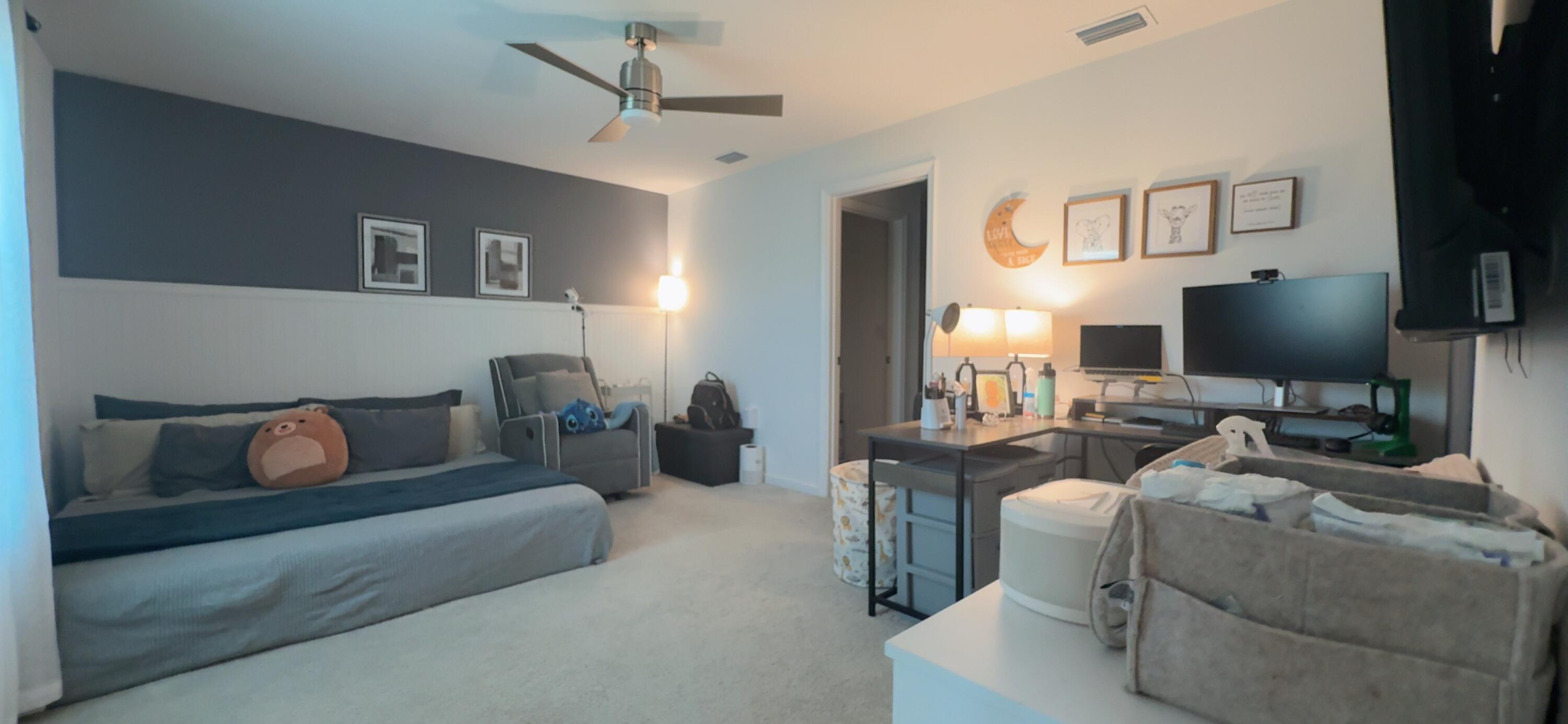 682 Papillon Street Southwest Palm Bay, FL 32908 - Photo 26 of 30 a living room with furniture and a flat screen tv